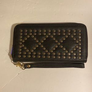 NWOT. Black wristlet with metal round embellishments.